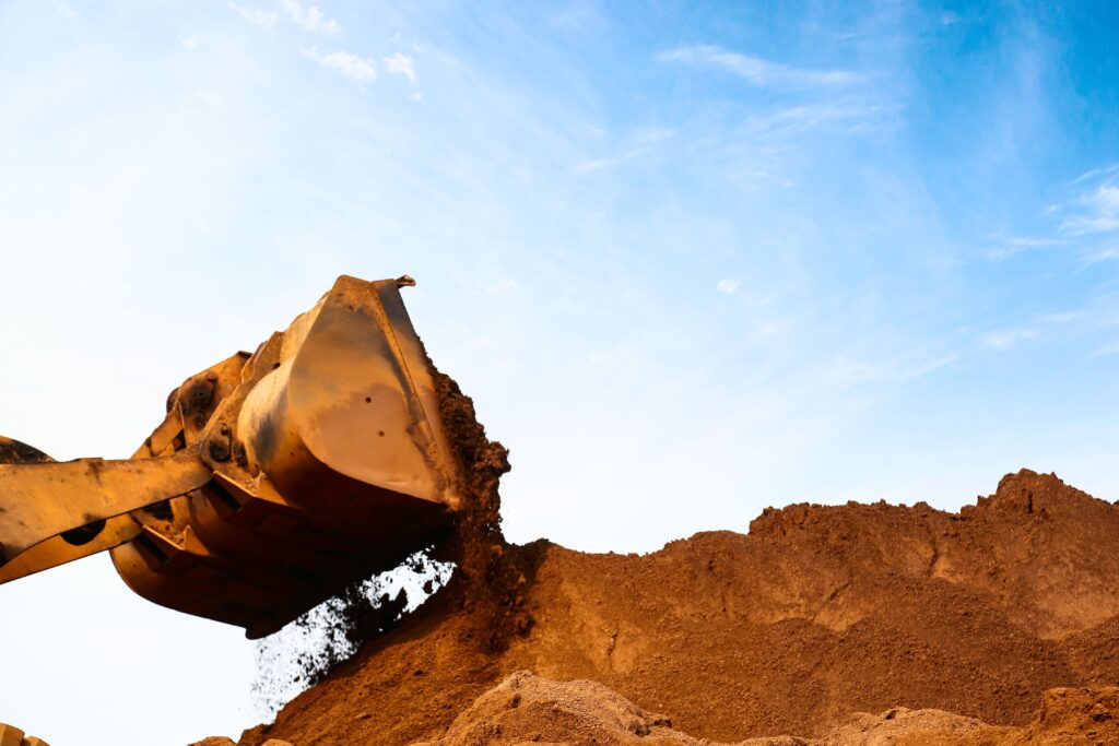 Bucket loader moving dirt