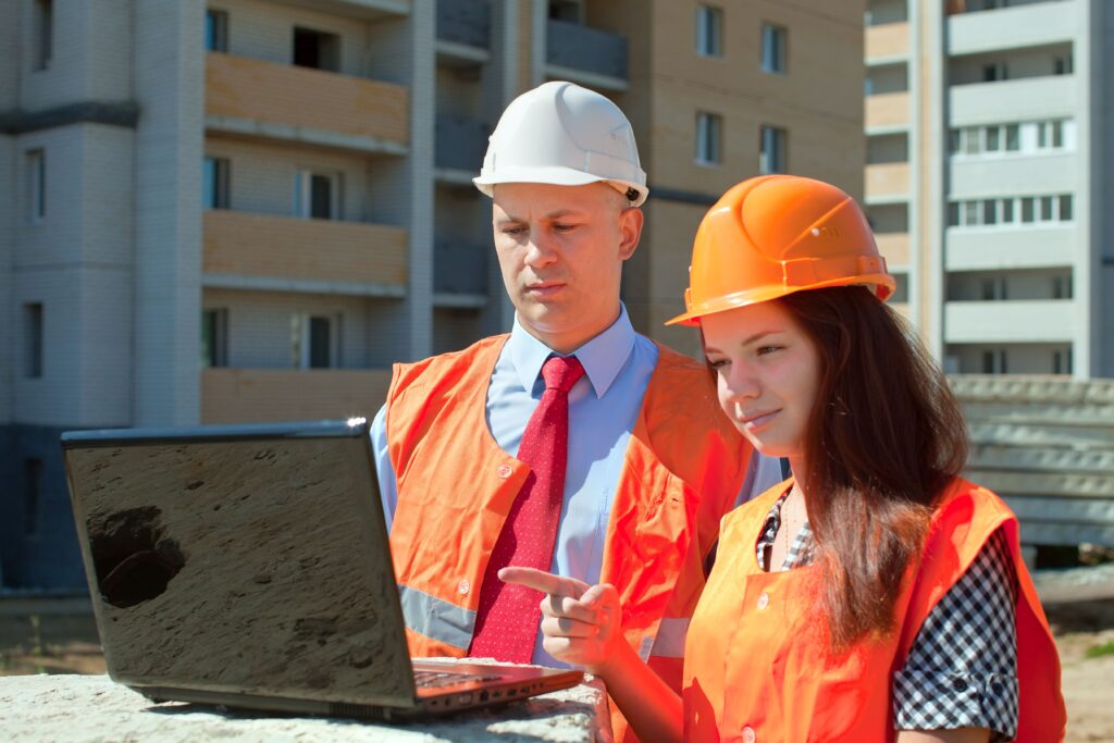 Two workers at construction site